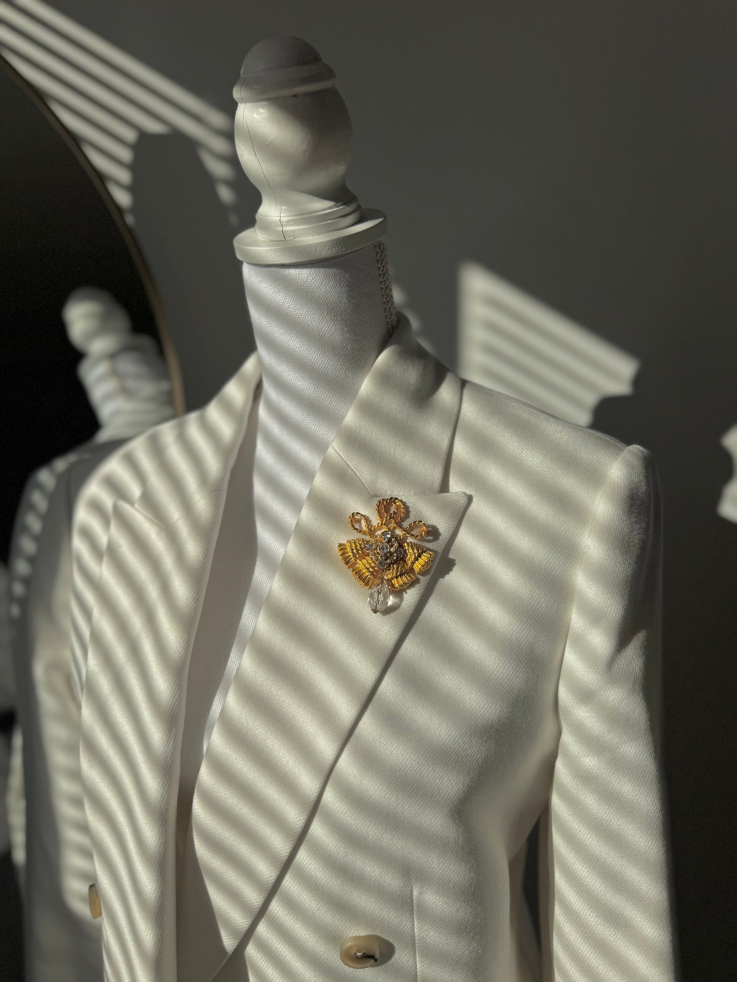 Rhinestone gold fringe brooch