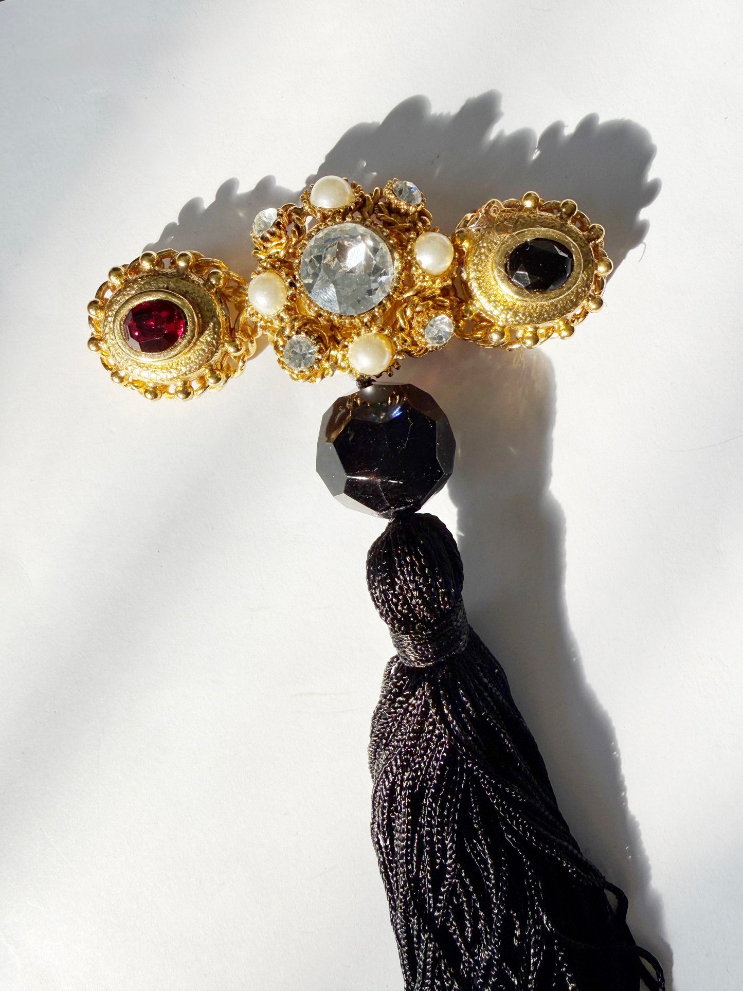 Regal rhinestone tassel brooch