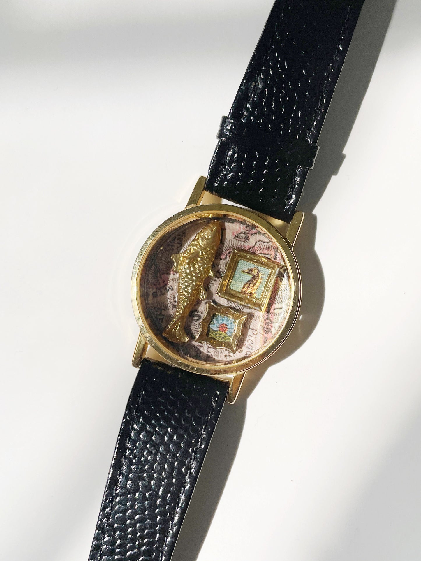 Miniature Marvels fish tales gallery wall watch