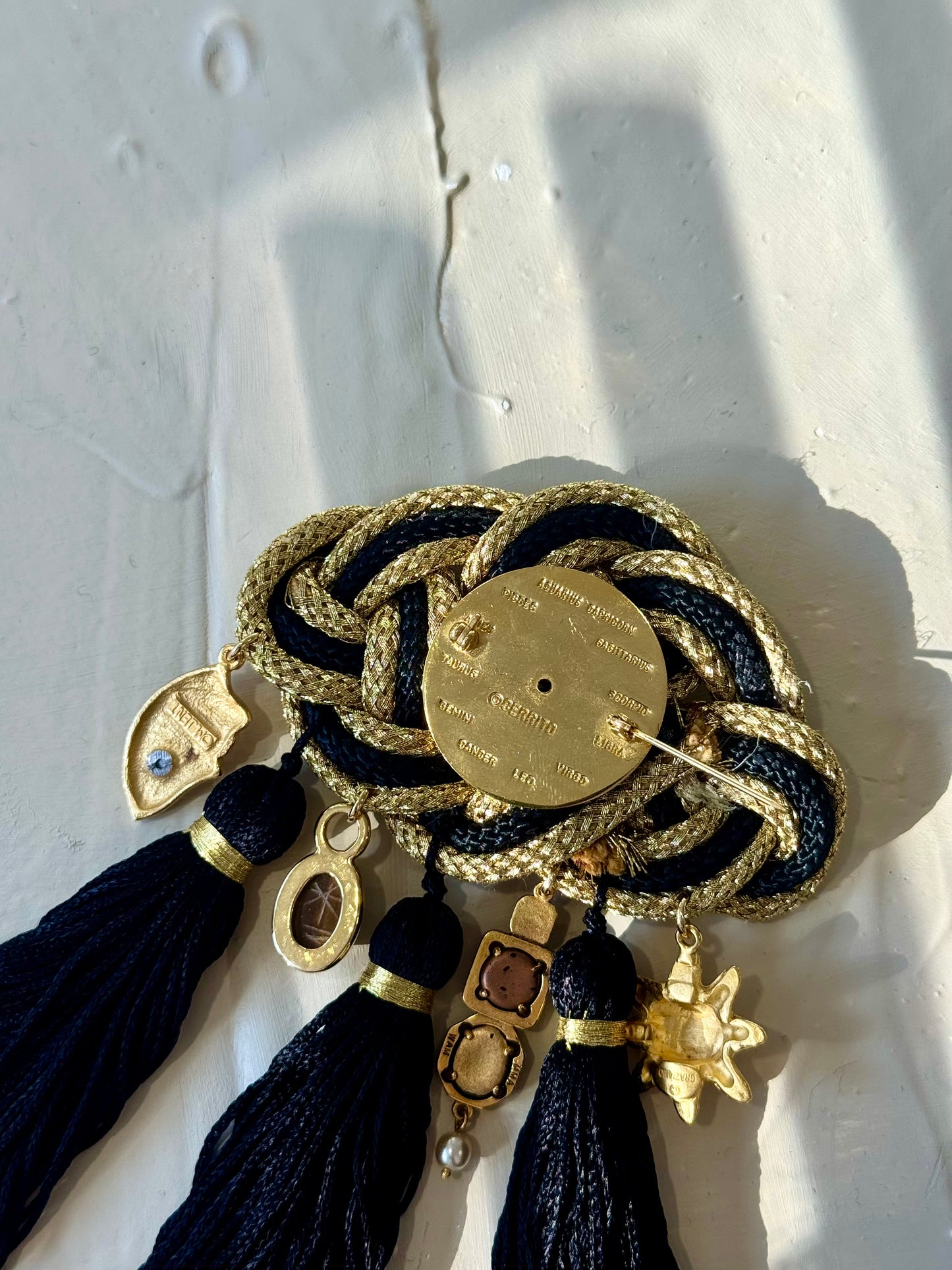Zodiac tassel brooch
