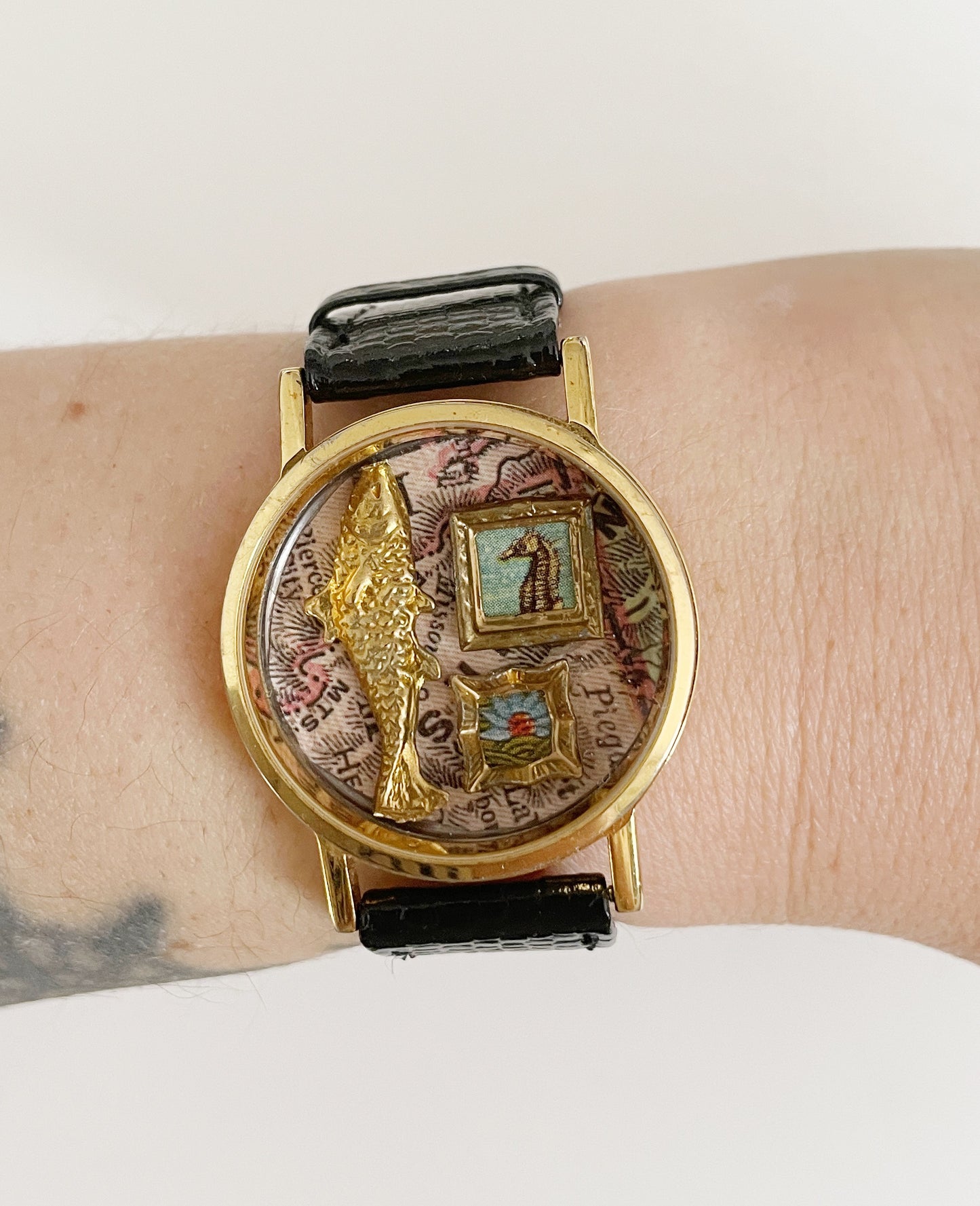 Miniature Marvels fish tales gallery wall watch