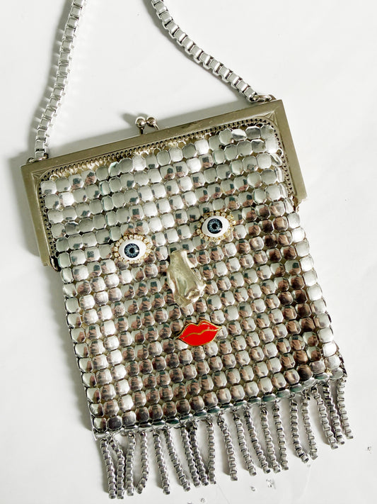 Ode to the master silver mesh purse