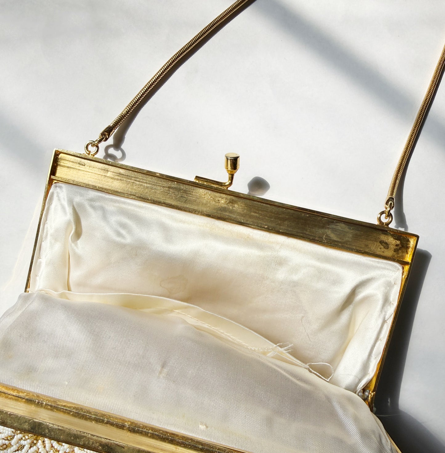 Ode to the master CRYBABY gold beaded purse