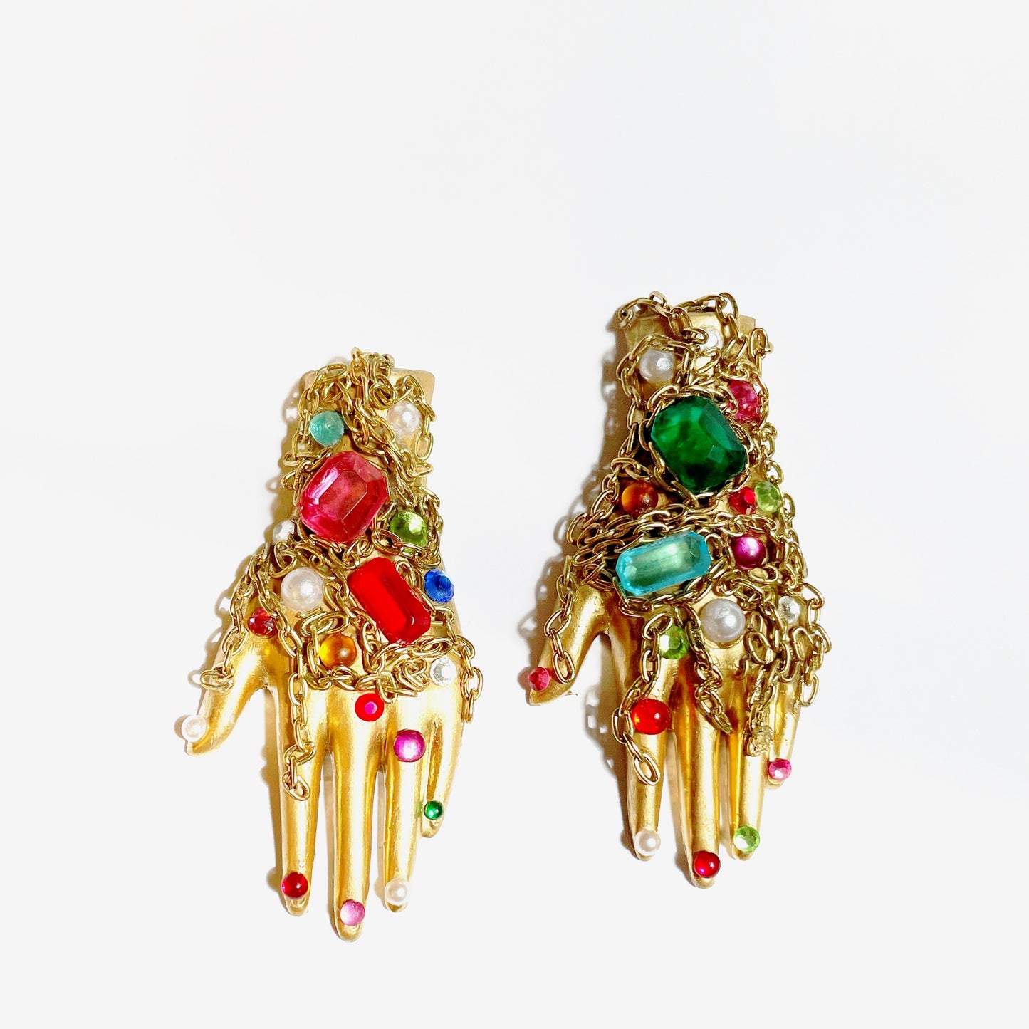 The adorned ceramic hand earrings