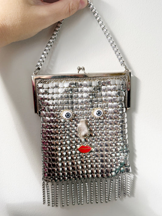 Ode to the master silver mesh purse