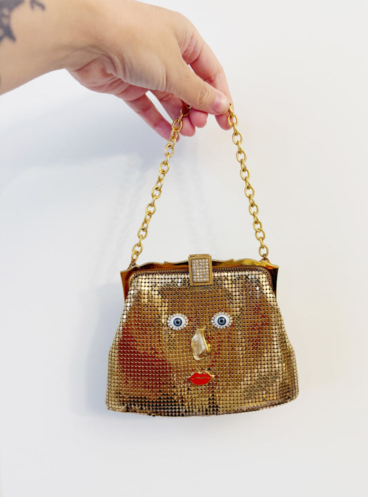Ode to the masters gold mesh purse