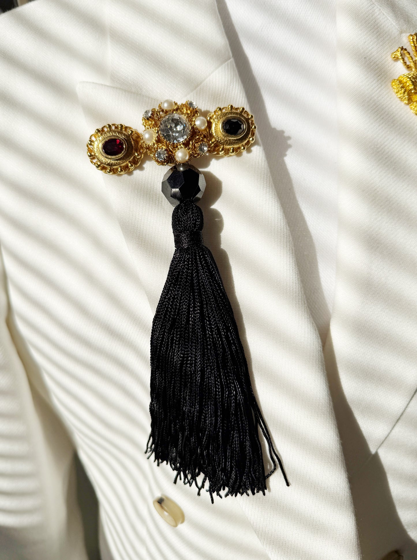 Regal rhinestone tassel brooch