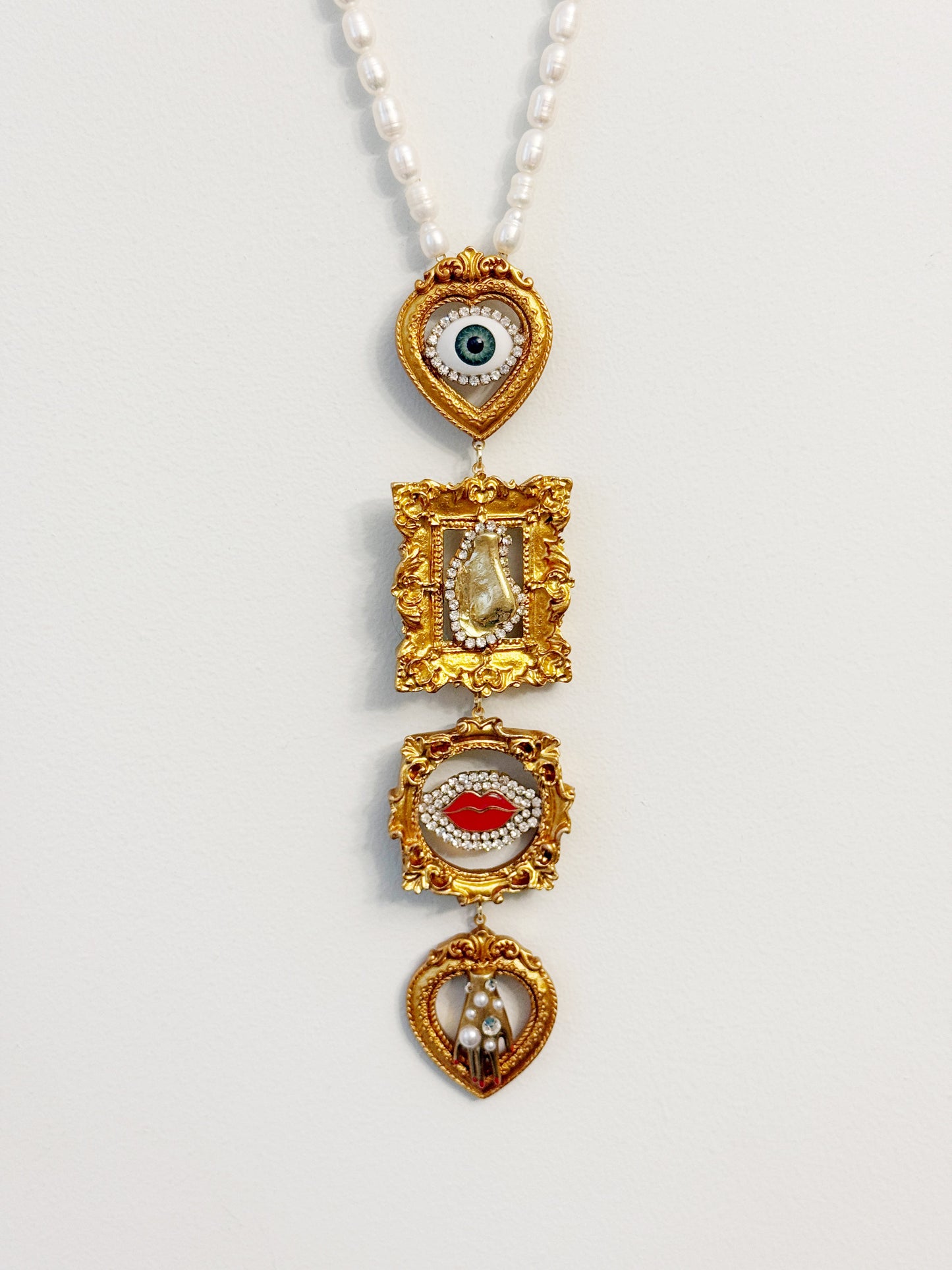 Gallery wall surrealist dream tie necklace