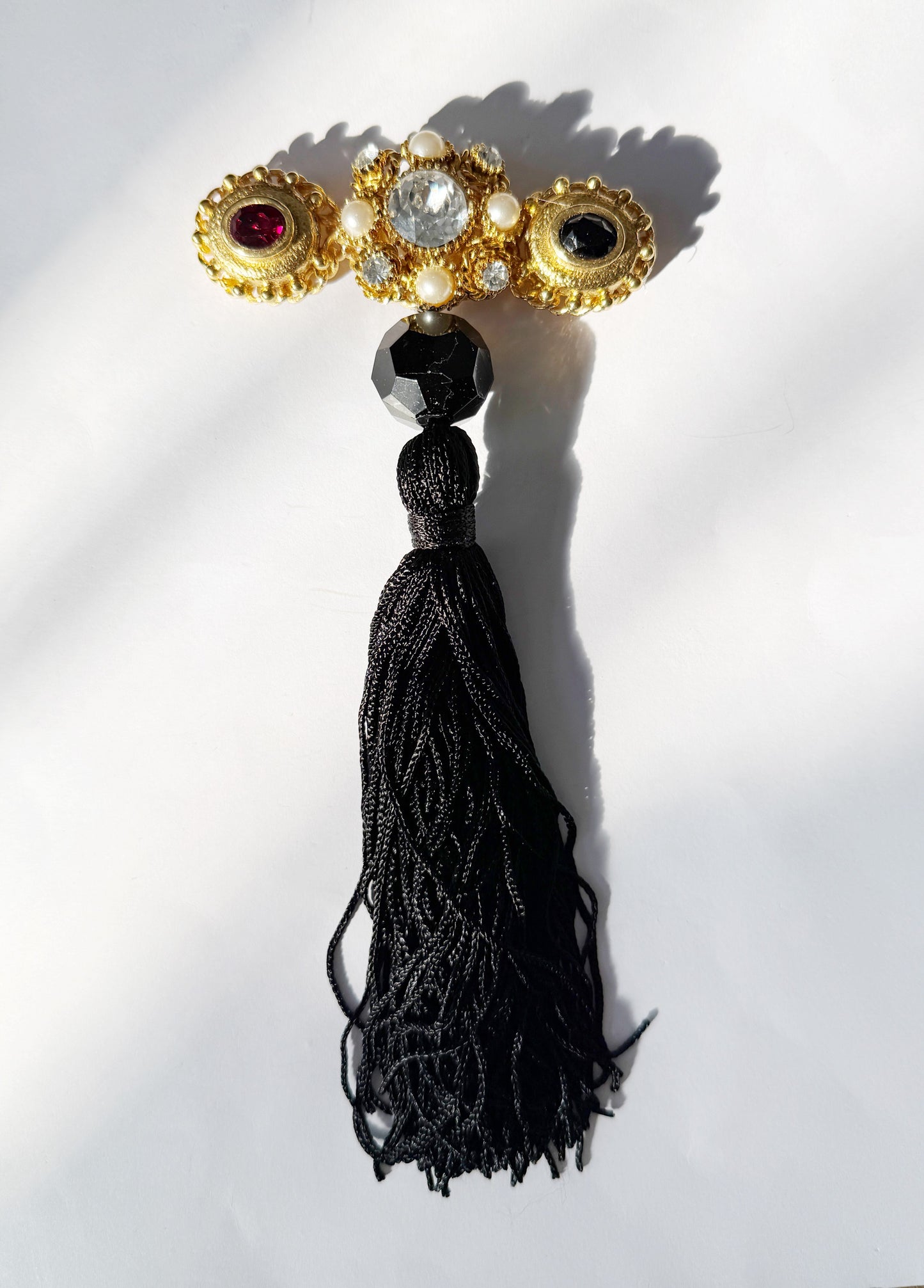 Regal rhinestone tassel brooch