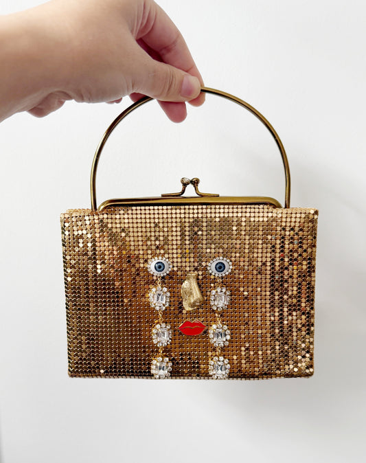 Ode to the master CRYBABY gold mesh purse