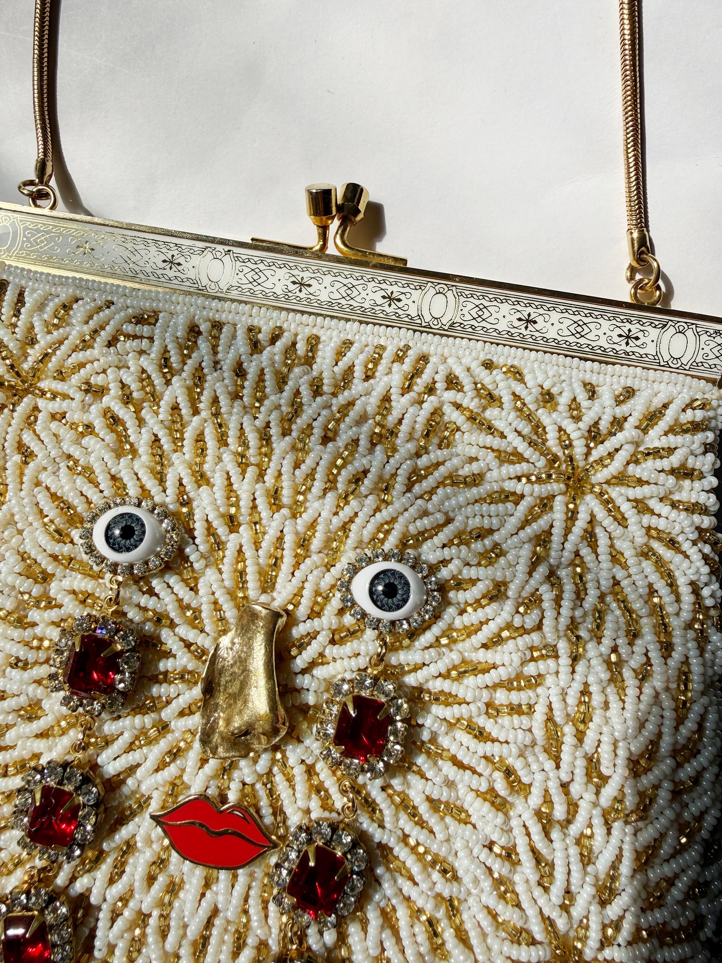 Ode to the master CRYBABY gold beaded purse