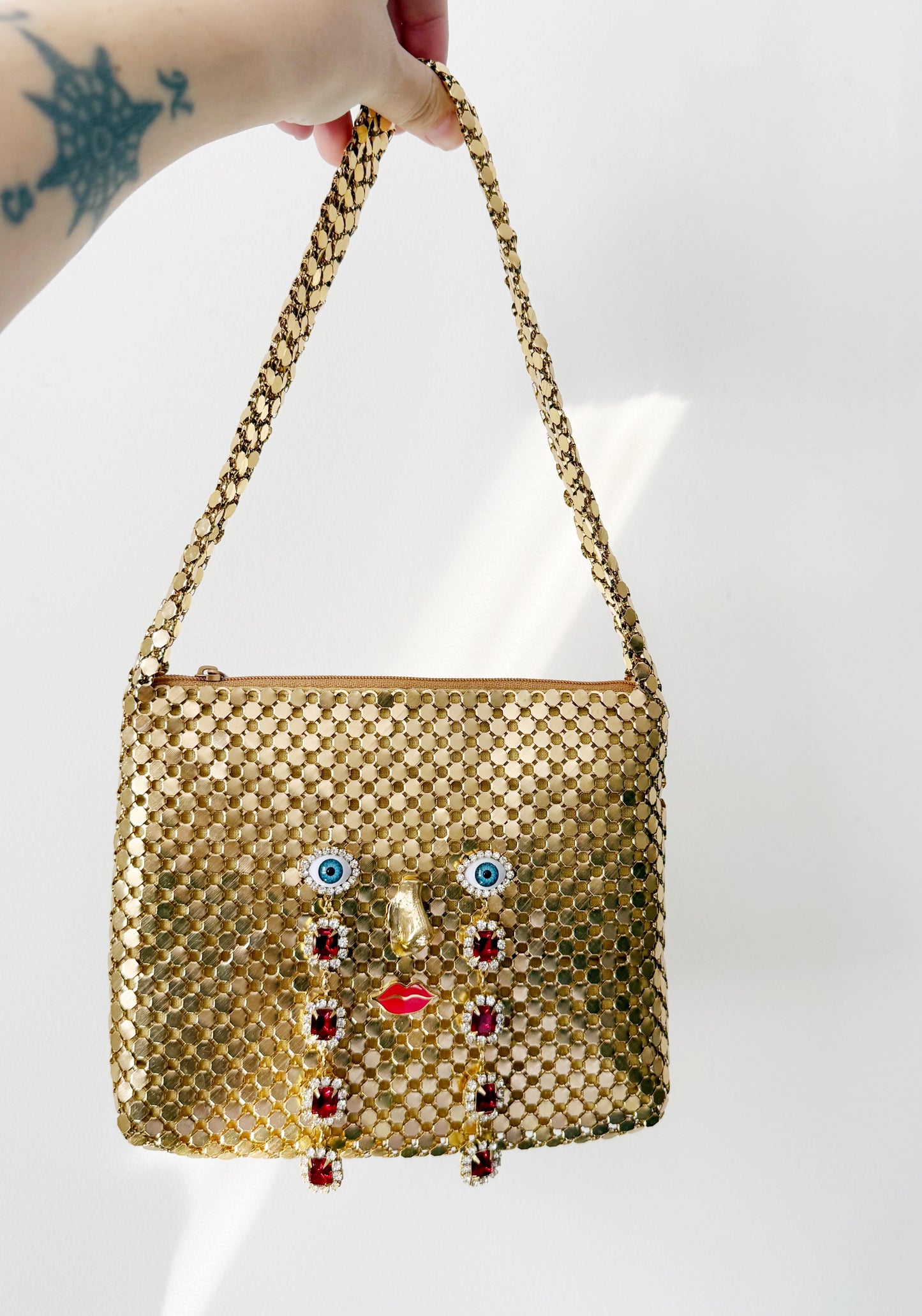 Ode to the master CRYBABY gold mesh purse