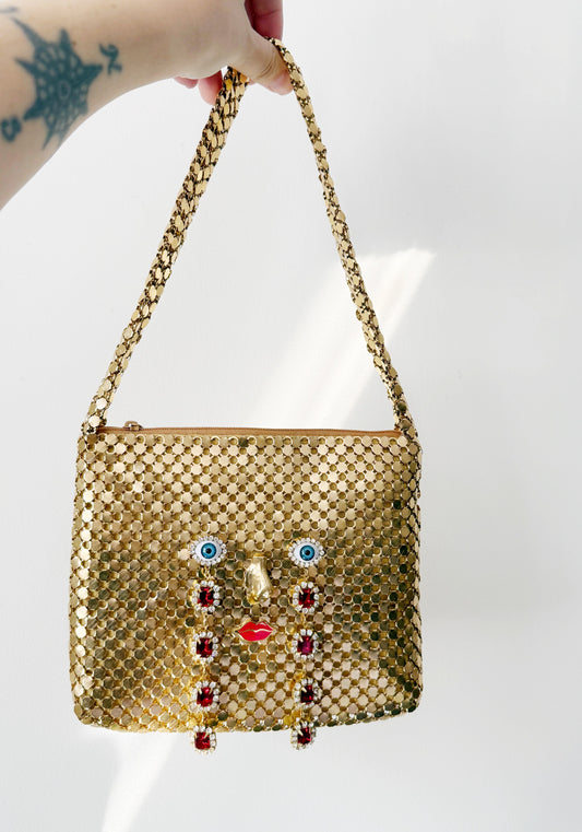 Ode to the master CRYBABY gold mesh purse