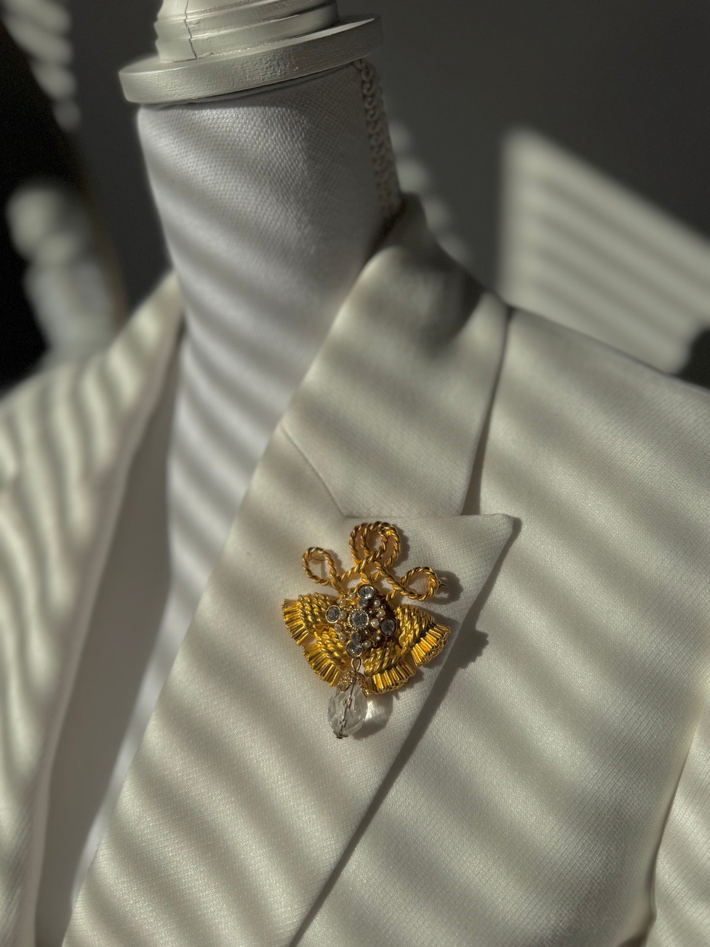 Rhinestone gold fringe brooch