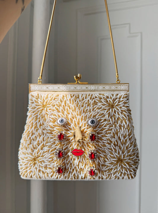 Ode to the master CRYBABY gold beaded purse