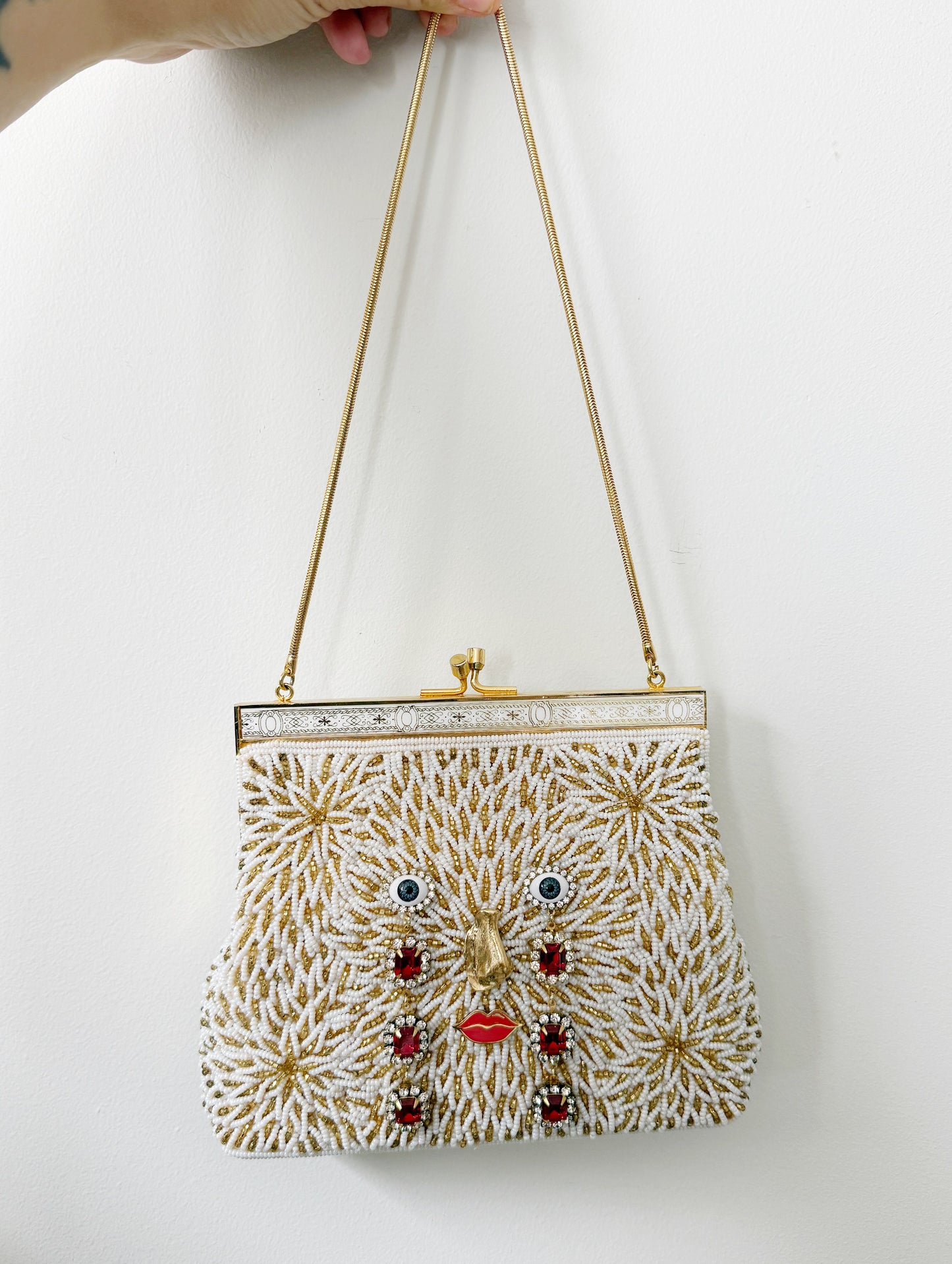 Ode to the master CRYBABY gold beaded purse