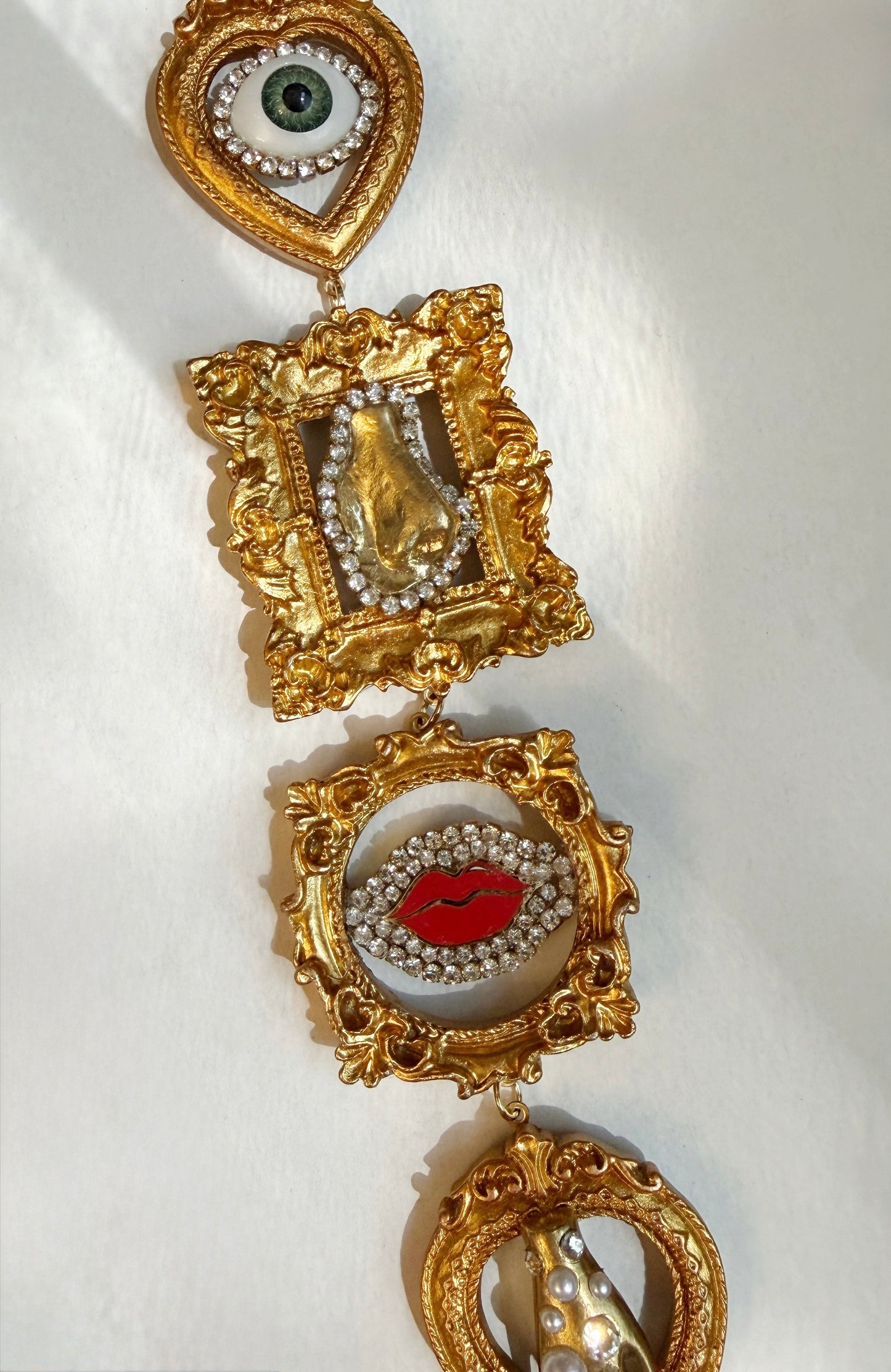 Gallery wall surrealist dream tie necklace