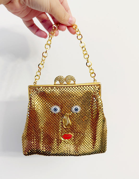 Ode to the masters gold mesh purse