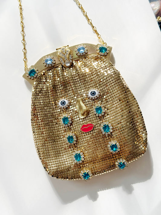 Ode to the master CRYBABY gold mesh purse