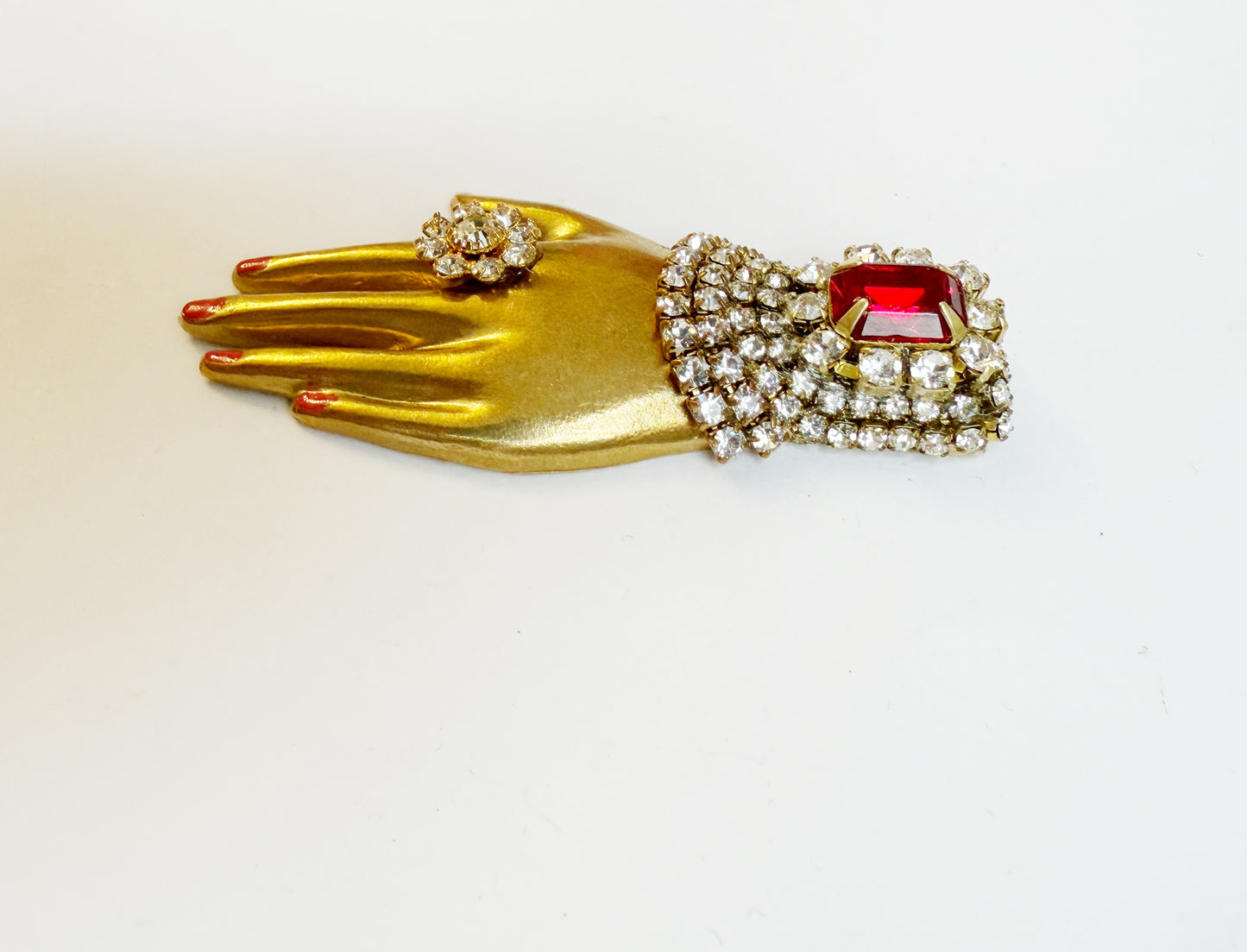Regal rhinestone hand brooch