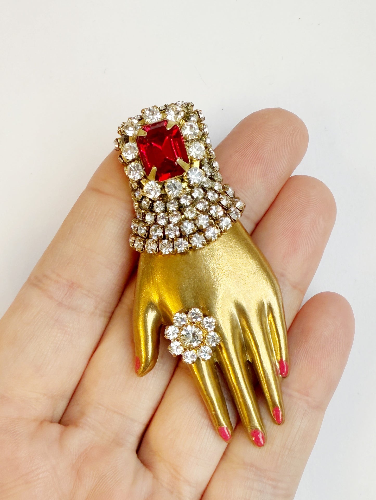 Regal rhinestone hand brooch