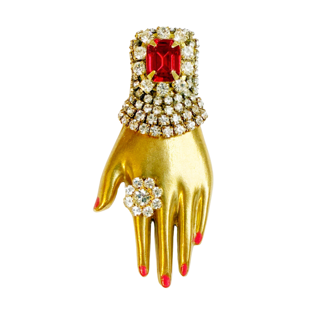 Regal rhinestone hand brooch