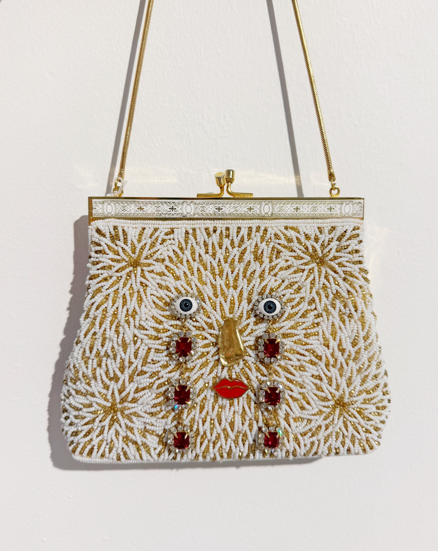 Ode to the master CRYBABY gold beaded purse